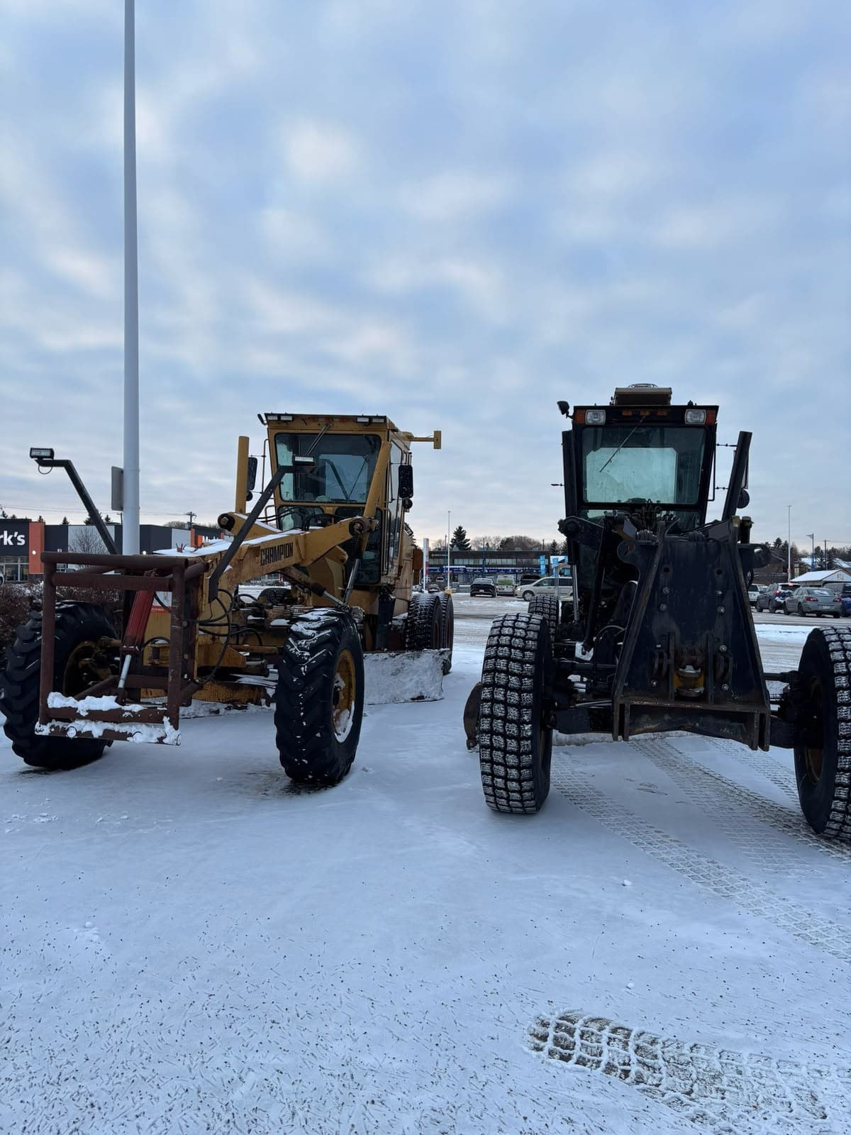 Graders clearing snow — dispatch and job-tracking software AltaPro AI builds for Edmonton snow-removal and contracting crews